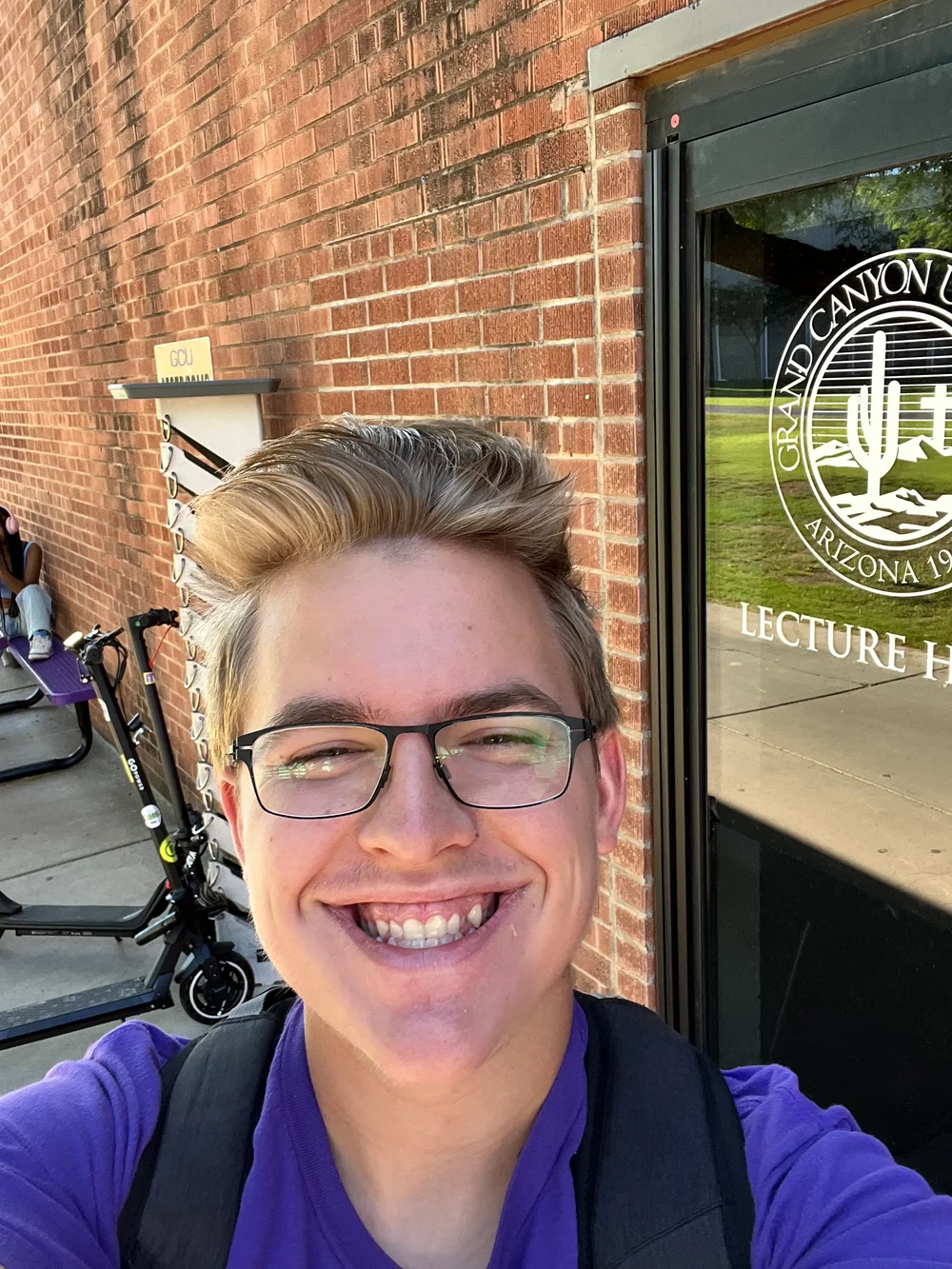 Joshua Sharpe smiling on the Grand Canyon University campus